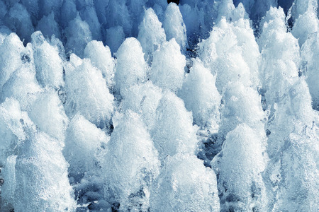 The gush of water of a fountain. Splash of water in the fountain, abstract image Detail and close upの写真素材