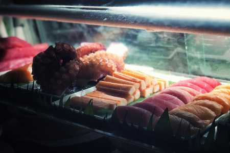Japanese food sashimi bar salmon ,octoput ,shimp and tuna concept low lightの写真素材