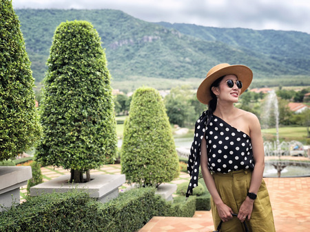 Woman wearing a planter panama hat visiting an Italian style village in summerの写真素材
