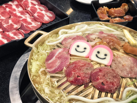 Smilling Thai barbecue buffet pork, meat, vegetable and noodle in Resturantの写真素材
