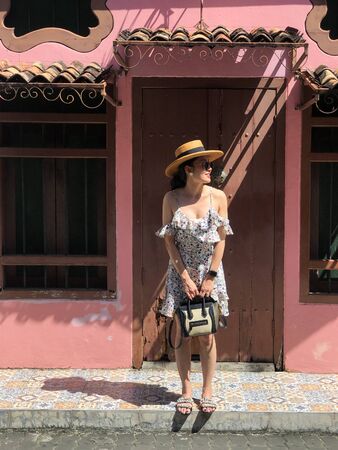 Young woman on beautiful walking street. Travelling in Phuket Old Town in Thailand.の写真素材