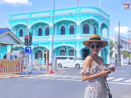 Young woman on beautiful walking street. Travelling in Phuket Old Town in Thailand. の写真素材