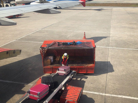 Baggage handlers working at Don Mueang International Airportのeditorial素材