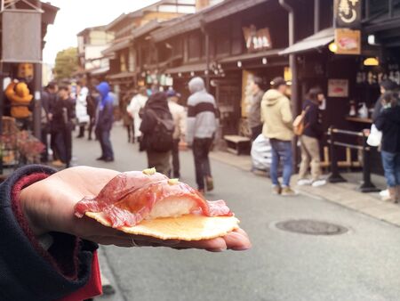Japanese street food close-up Hida Beef Sushi and cracker at Takayama, Japanの写真素材