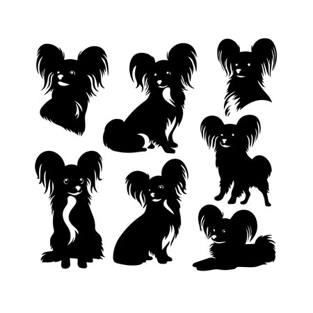 Papillon dog silhouettes isolated on white background. Vector illustration.のイラスト素材