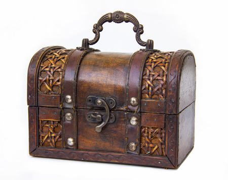 an old chest made of wood and leather with an iron handle and lockの写真素材