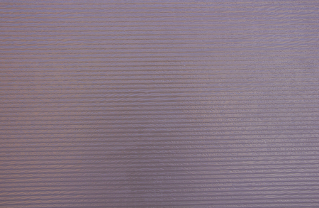 metal corrugated uneven painted brown wall backgroundの写真素材