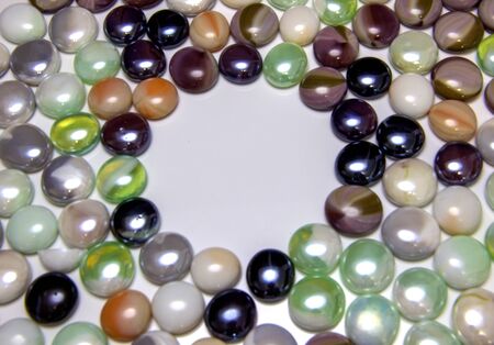 background of colored round smooth multicolored pebblesの写真素材