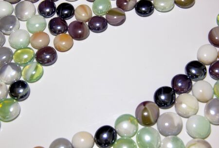 background of colored round smooth multicolored pebblesの写真素材
