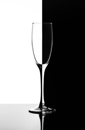 glass for champagne or wine in the style of Domino half black the other half whiteの写真素材