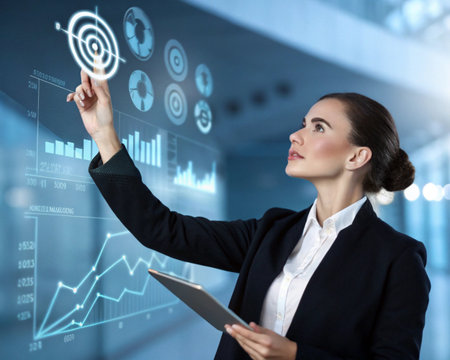 A professional woman analyzes a glowing holographic interface displaying charts, graphs, and a bullseye target.の素材
