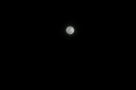 full moon on a background of dark sky without cloud in the nightの写真素材