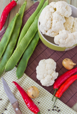 cauliflower and hot red pepper on the tableの写真素材