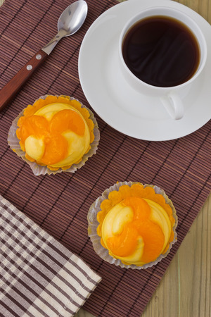 two tasty orange cake on the tableの写真素材