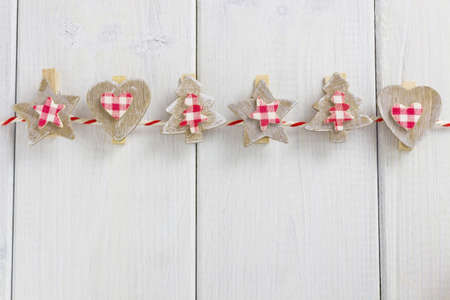 christmas garland on a white wooden backgroundの写真素材