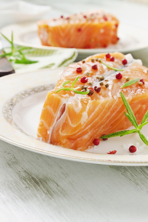 salmon fillet on a plate on the table close-up. selective focus. health and diet foodの写真素材