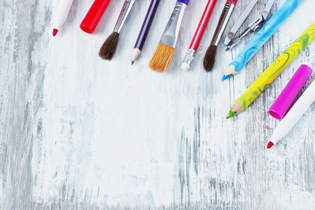 school accessories on an old white wooden background. back to school concept. copy space bacgroundの写真素材