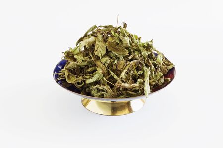 dried mint leaves on a white background. medicinal teaの写真素材