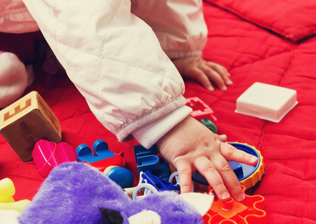 child playing with toys on the street. carefree childhood.selective focusの写真素材