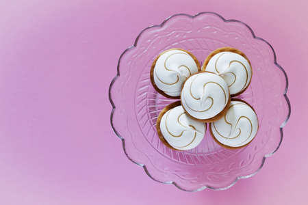marshmallow cookies on a plate on pink background. sweet table. top view. copy space backgroundの写真素材