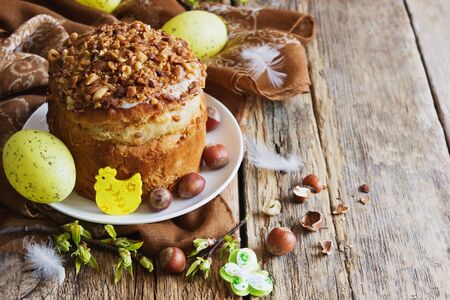 easter cake and holiday decorations on the wooden background. holidays and events. selective focus