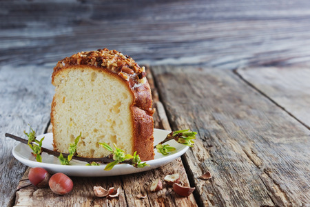 piece easter cake on the plate on a wooden background. holidays and events. selective focus. copy...