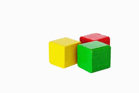 colored wooden cubes for child development on a white background. kids toys. selective focusの写真素材