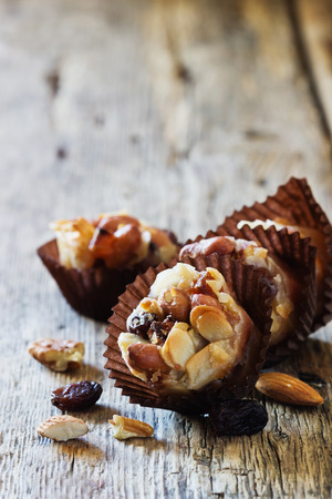 Homemade sweets with nuts, raisins and caramel. Oriental traditional cuisine. Close-up. Selective focusの写真素材