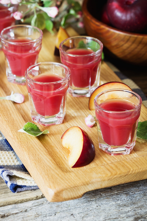 Traditional homemade plum liqueur. Alcoholic drinks. Selective focusの写真素材