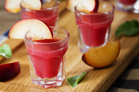 Traditional homemade plum liqueur. Alcoholic drinks. Selective focusの写真素材