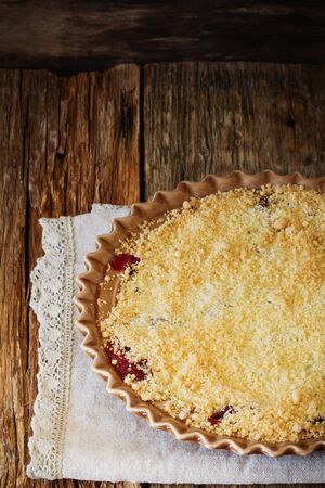 Plum crumble in a plate on the table. Traditional English cuisine. Selective focusの写真素材
