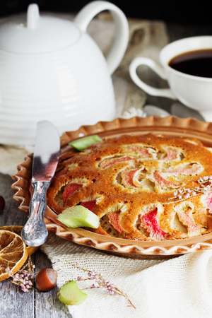 Traditional homemade rhubarb pie in a dish on the table. Tasty breakfast. Selective focusの写真素材