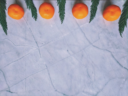 Festive white background. The spruce branch is green. Mandarins. Winter postcard. Christmas card....