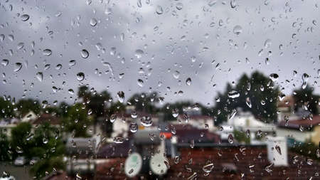 Background of rain drops on window close up. Flat lay.の写真素材