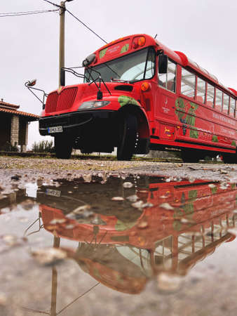 Koper, Slovenia. Red tourist bus on the Slovenian coast, related to the wine fountain. Holiday concept.のeditorial素材