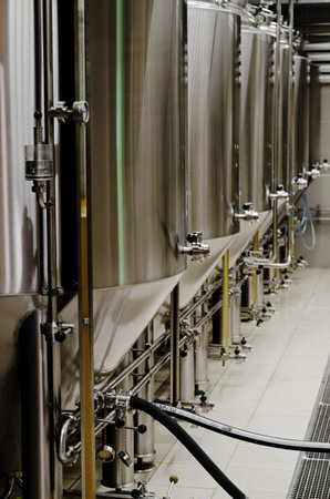 PortoroÅ¾, Slovenia. 05.26.2021. Craft beer brewing equipment in the brewery. Modern beer plant. Metal tanks, process of alcoholic drink production.のeditorial素材