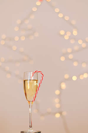 Two glasses of wine with bokeh background close up. Top view. New Year, Christmas mood. Greeting card. Party and holiday celebration concept.の写真素材