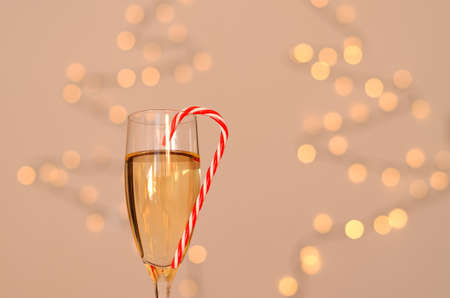 Two glasses of wine with bokeh background close up. Top view. New Year, Christmas mood. Greeting card. Party and holiday celebration concept.の写真素材