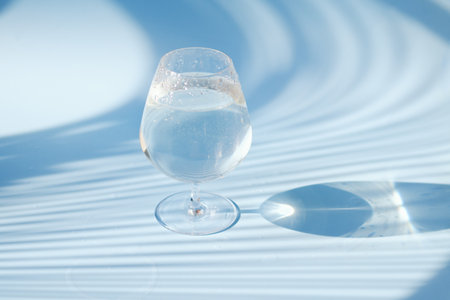 A glass of water on blue background. Top view, copy space, mockup. flat lay. healthy lifestyle. food...