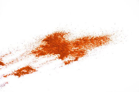 Red chili pepper powder isolated on white backgroundの写真素材