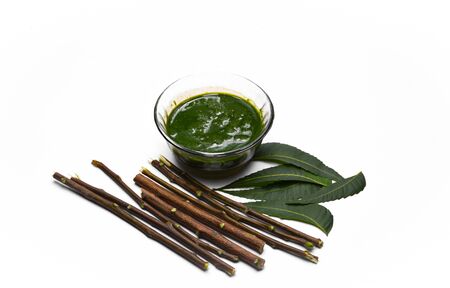 Medicinal ayurvedic azadirachta indica or Neem leaves with neem paste isolated on white background
