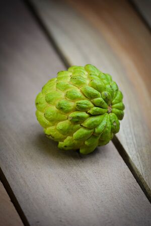 Fresh Custard Apple on wooden table backgroundの写真素材