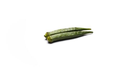 Fresh young okra or ladyfinger isolated on white backgroundの写真素材