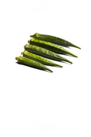 Fresh young okra or ladyfinger isolated on white background