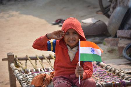 TIKAMGARH, MADHYA PRADESH, INDIA - JANUARY 22, 2020: Unidentified indian village little boy holding...