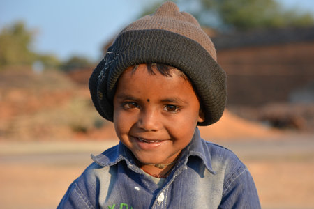 TIKAMGARH, MADHYA PRADESH, INDIA - FEBRUARY 11, 2020: Little kid smiling at the camera.のeditorial素材