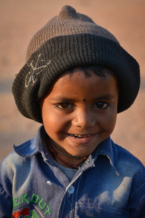 TIKAMGARH, MADHYA PRADESH, INDIA - FEBRUARY 11, 2020: Little kid smiling at the camera.のeditorial素材