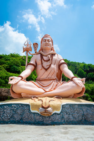 Hindu god Shiva sculpture sitting in meditation. Yoga and meditation concept.の写真素材