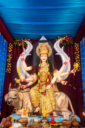 A beautiful idol of Maa Durga being worshipped at a pandal during Navratri. Navratri is biggest...