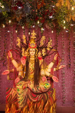 A beautiful idol of Maa Durga being worshipped at a pandal during Navratri. Navratri is biggest...